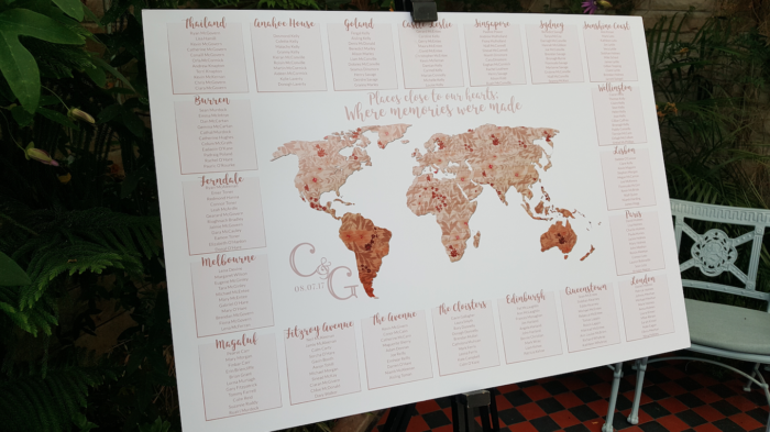 Seating plan delight - World map design with tables as places the couple have travelled too together